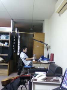 In the corner there is main door & here he is my roommate, Xinming (he is usually called "X" to simplify his name)